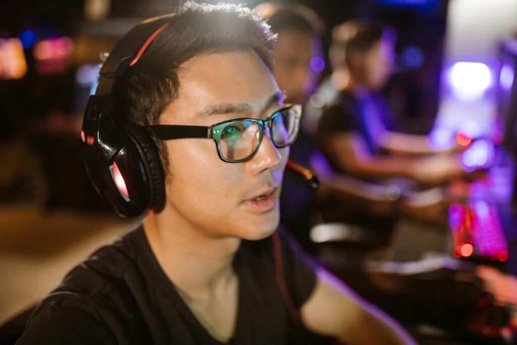 Shallow Focus Photo of a Man Wearing Black Headphones